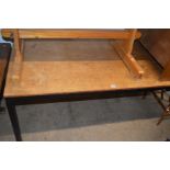 AN OAK FINISHED TOPPED SCHOOL DESK on a black painted steel frame, length 183cm x width 84cm (The