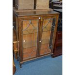 A 20TH CENTURY OAK LEAD GLAZED TWO DOOR CHINA CABINET, width 93cm x depth 27cm x height 27cm