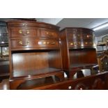 A PAIR OF MODERN MAHOGANY BOW FRONT BEDSIDE CHESTS with a brushing slide, two short and one long