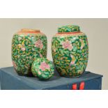 A BOXED PAIR OF CHINESE GINGER JARS, enamelled floral and insect pattern on green ground, orange