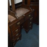 A MODERN MAHOGANY KNEE HOLE DESK with fawn coloured leather top and two frieze drawers below, each