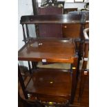 AN EDWARDIAN MAHOGANY TWO TIER STAND together with a Victorian mahogany four tier hanging wall shelf
