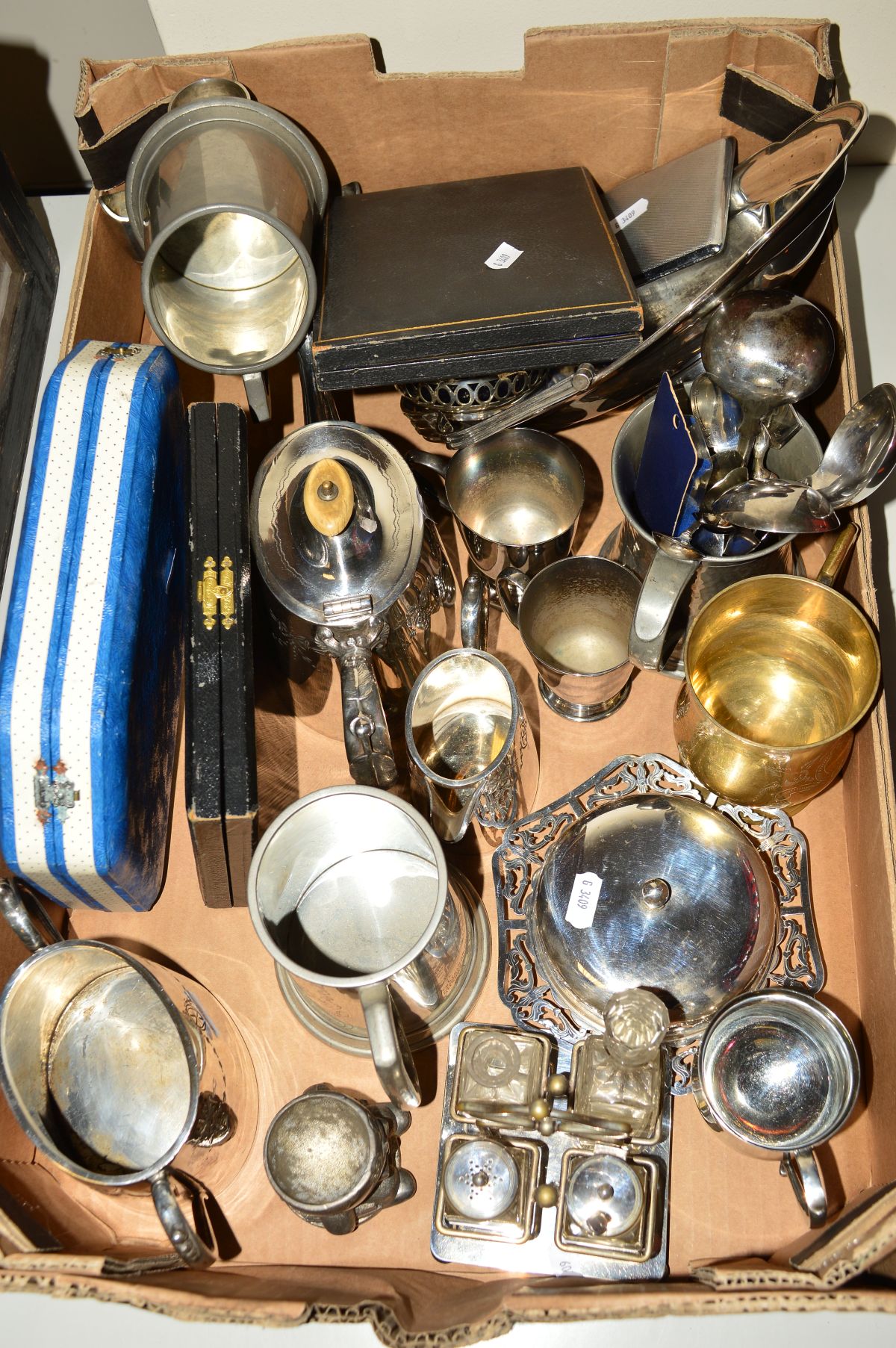 A BOX OF METALWARE, to include a butter dish, cased spoon and sugar tong sets, collectors spoons,