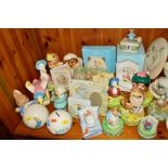 A GROUP OF VARIOUS BEATRIX POTTER MUSICAL BOXES, MONEY BANKS, PHOTO FRAMES etc, to include a boxed