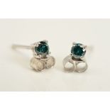 A PAIR OF 18CT GOLD TREATED BLUE DIAMOND STUD EARRINGS, each designed as a single brilliant cut