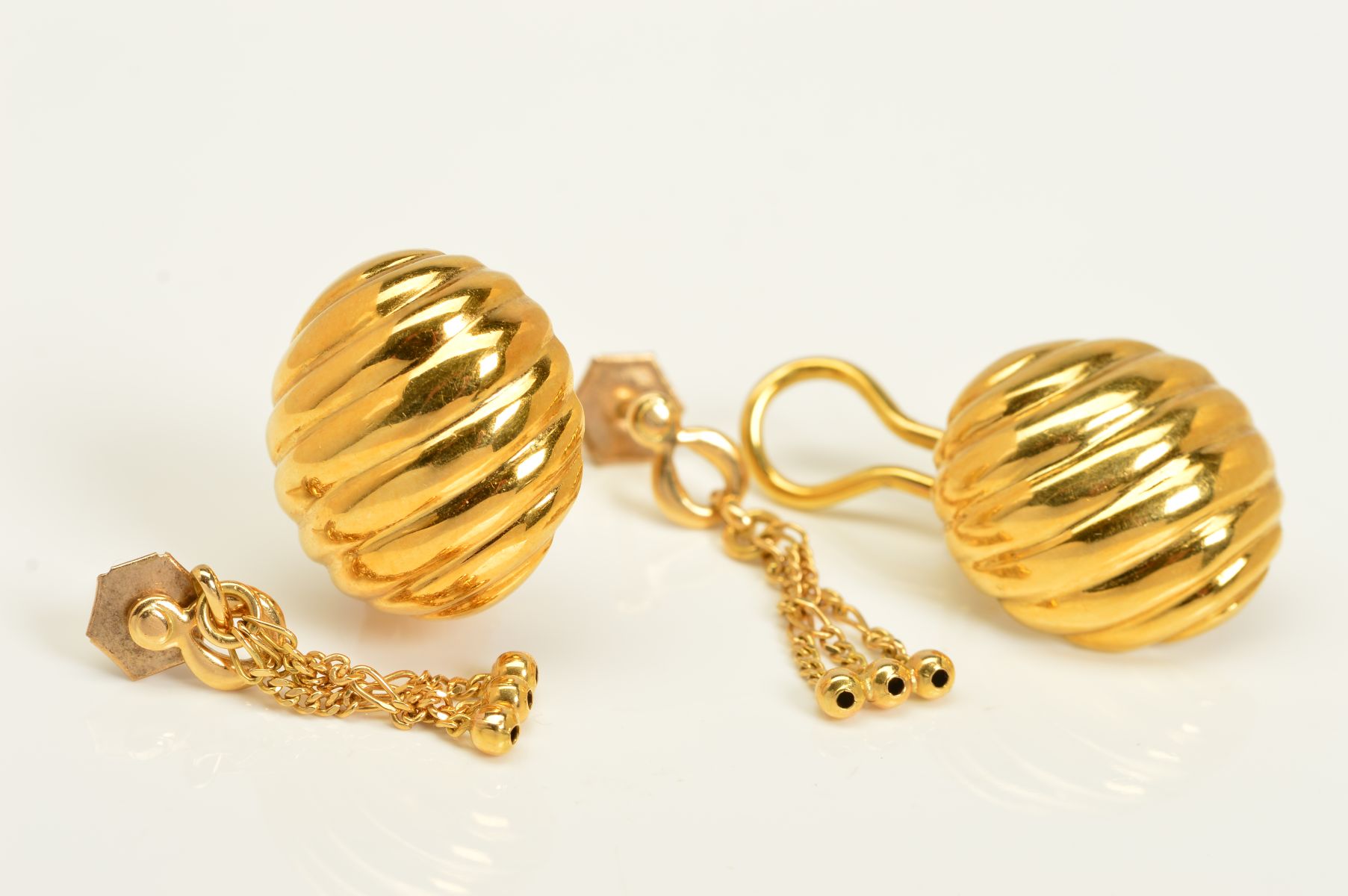 TWO PAIRS OF EARRINGS, the first pair designed as textured dome clip on earrings, with 18ct import
