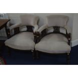 A PAIR OF EDWARDIAN WALNUT TUB CHAIRS