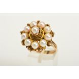 A CULTURED PEARL RING, designed as a central spherical cultured pearl in a decorative four claw