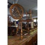 A 20TH CENTURY CARVED OAK SPINNING WHEEL