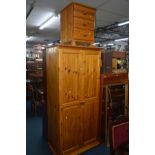 A PINE DOUBLE DOOR WARDROBE, width 92cm x depth 58cm x height 195cm together with a three drawer