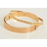TWO 9CT GOLD BANGLES, the first of octagonal design with polished finish, the second of