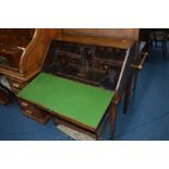 A GEORGIAN OAK BUREAU ON BLOCK LEGS with an intricate bombe fronted drawer arrangement to the