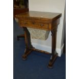 A VICTORIAN ROSEWOOD WORK TABLE, the fold over top revealing a tooled green leather inlay above a