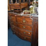 A GEORGIAN FLAME MAHOGANY BOW FRONT CHEST OF TWO SHORT AND THREE LONG DRAWERS with brass handles