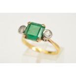 AN EMERALD AND DIAMOND RING, the central square cut emerald within a four claw setting flanked by
