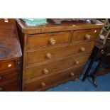 A VICTORIAN MAHOGANY CHEST OF TWO SHORT OVER THREE LONG DRAWERS with turned handles and bun feet,
