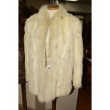 A LYNX FOX FUR JACKET, the stencilled fox fur jacket with Mandarin collar three hook fastenings, two