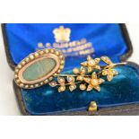 TWO LATE 19TH CENTURY TO EARLY 20TH CENTURY GOLD BROOCHES, the first an oval memorial brooch with