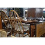 AN ERCOL GOLDEN DAWN REFECTORY TABLE, width 152cm x depth 84cm x height 72cm and four spindle hoop