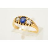 AN 18CT GOLD LATE VICTORIAN SAPPHIRE AND DIAMOND RING, designed with a central oval cut sapphire