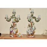 A PAIR OF DRESDEN AUGUSTUX REX STYLE FIGURAL CANDELABRA, each candlestick with three branches and