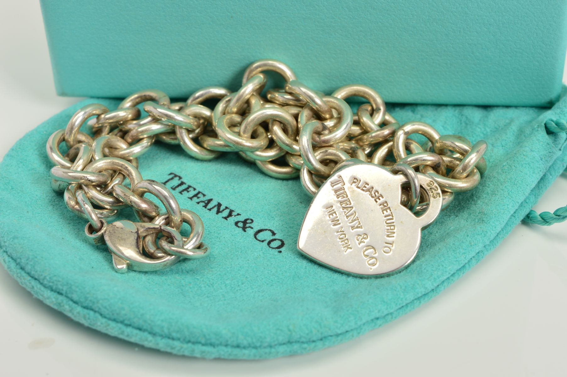 A TIFFANY & CO NECKLACE, designed as a belcher link chain suspending a heart shape pendant