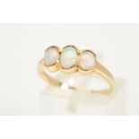 A 9CT GOLD OPAL RING, designed with three graduated oval cabochon opals within collet mounts to
