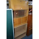 A MID CENTURY LIGHT OAK FALL FRONT BUREAU with two sliding glass doors over two sliding wood