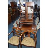 AN EDWARDIAN MAHOGANY DOUBLE SIDED FOLDING CAKE STAND together with an Edwardian plant stand,