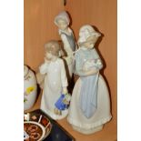 THREE NAO FIGURES, Girl holding pup in blanket No241, height 25.5cm, 'My Rag Doll' No 1108 and