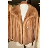 A LADIES DARK BEIGE MINK JACKET, having feature scalloping all around the hem, fabric decorated