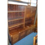 A MID 20TH CENTURY WALNUT THREE SECTION LOUNGE SET including one with two glazed doors over open