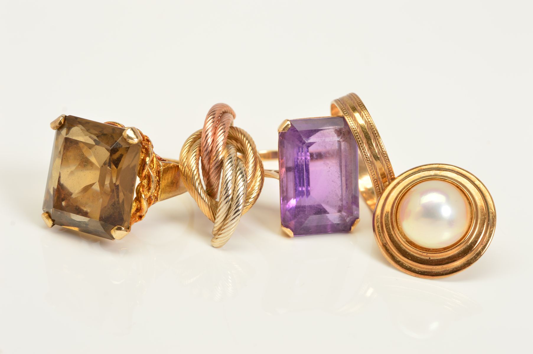 THREE RINGS AND TWO SINGLE EARRINGS, the rings to include a square cut smoky quartz in a four claw