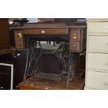 AN OAK SINGER TREADLE SEWING MACHINE, together with two other sewing machines (sd)