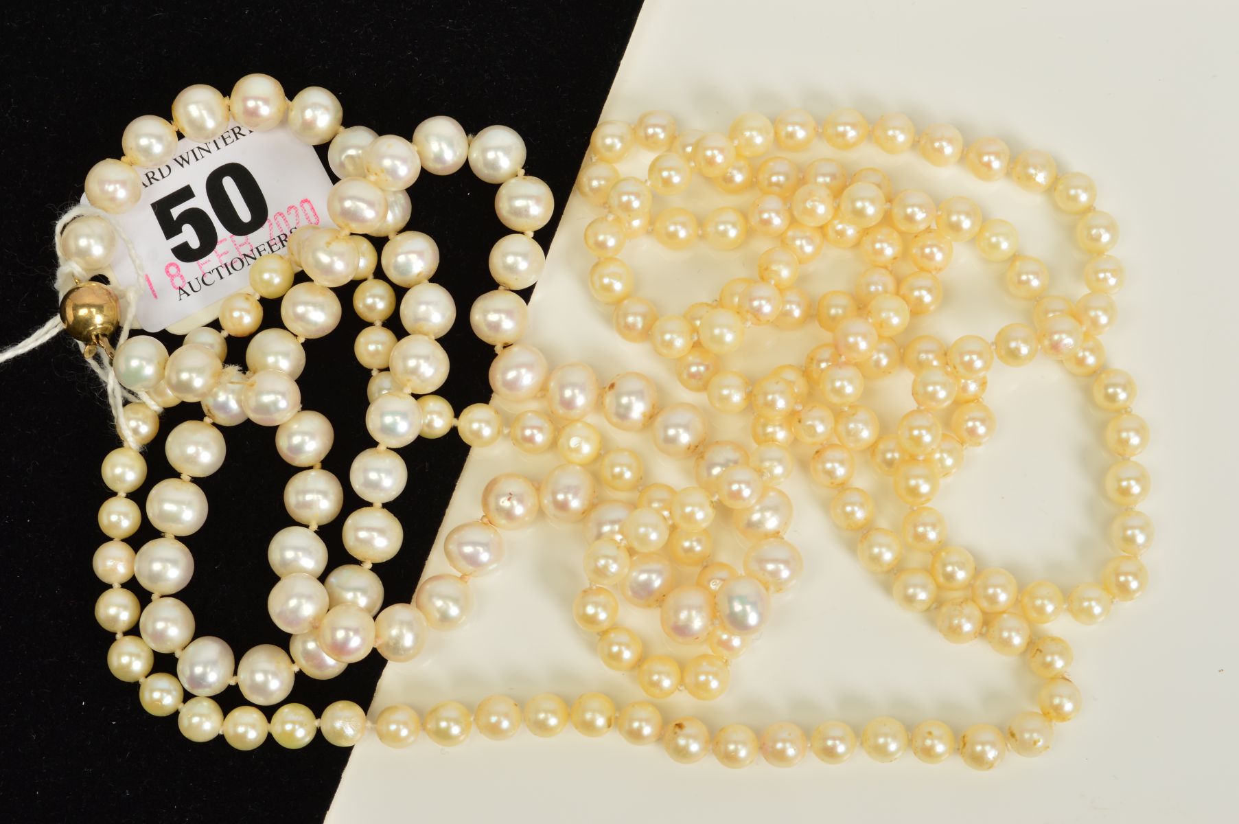 TWO CULTURED PEARL NECKLACES, both designed as a uniform row of spherical cultured pearls, one