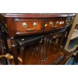 A REPRODUCTION MAHOGANY BOW FRONT SIDE TABLE with three drawers, width 102cm x depth 52cm x height