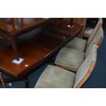A DANISH FARSTRUP ROSEWOOD EFFECT EXTENDING DINING TABLE, two additional leaves, extended width