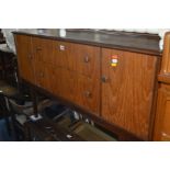 A MID 20TH CENTURY TEAK DRESSING TABLE with a single rectangular mirror and two central drawers,