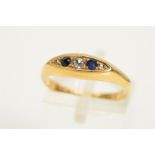 AN EARLY 20TH CENTURY 18CT GOLD SAPPHIRE AND DIAMOND RING, designed as three single cut diamonds
