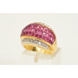 A RUBY AND DIAMOND DRESS RING, the central domed panel comprising four rows of square cut rubies,