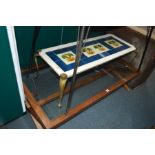 A MODERN RECTANGULAR GLASS TOPPED COFFEE TABLE, together with a brass and tile topped coffee table