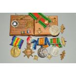 A BOX CONTAINING A WW1 1914-15 STAR TRIO OF MEDALS NAMED TO 499 GUNNER A.E.HOWLETT, DVR on star, two