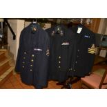 THREE ROYAL NAVY UNIFORM JACKETS AND TROUSERS, various rank and formation patches, WWII/Korean