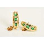 A PAIR OF 18CT GOLD, DIAMOND AND EMERALD EARRINGS, each designed as a tapered curved line, set