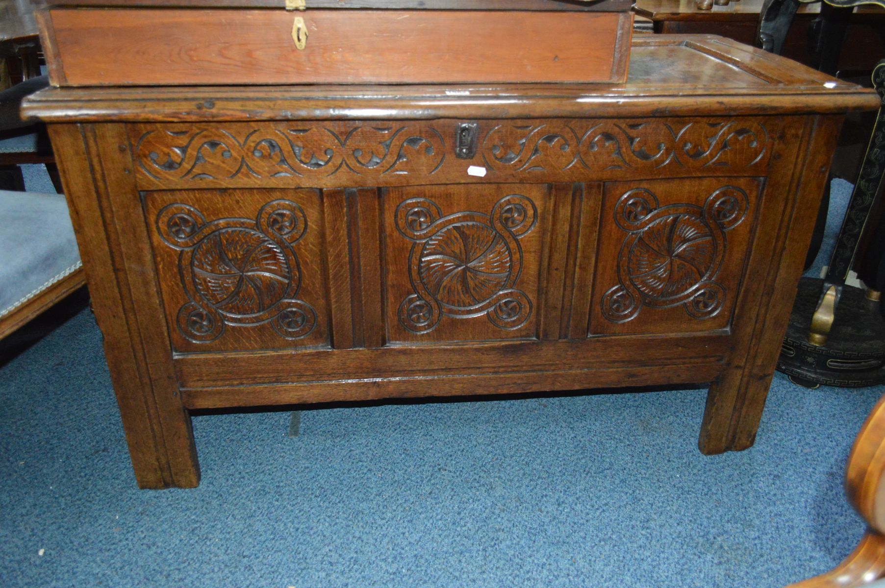 A GEORGIAN OAK TRIPLE PANEL COFFER, with intertwined swag decoration, width 117cm x depth 56cm x