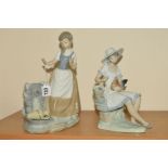 TWO NAO FIGURES, Girl with Broken Jug, No0223, height 29cm and seated girl feeding chicken, height