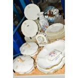 A QUANTITY OF FRENCH MONOGRAMMED WHITE CHINA DINNERWARES, having scroll borders with gilt edges,