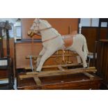 A ROCKING HORSE on a beech frame