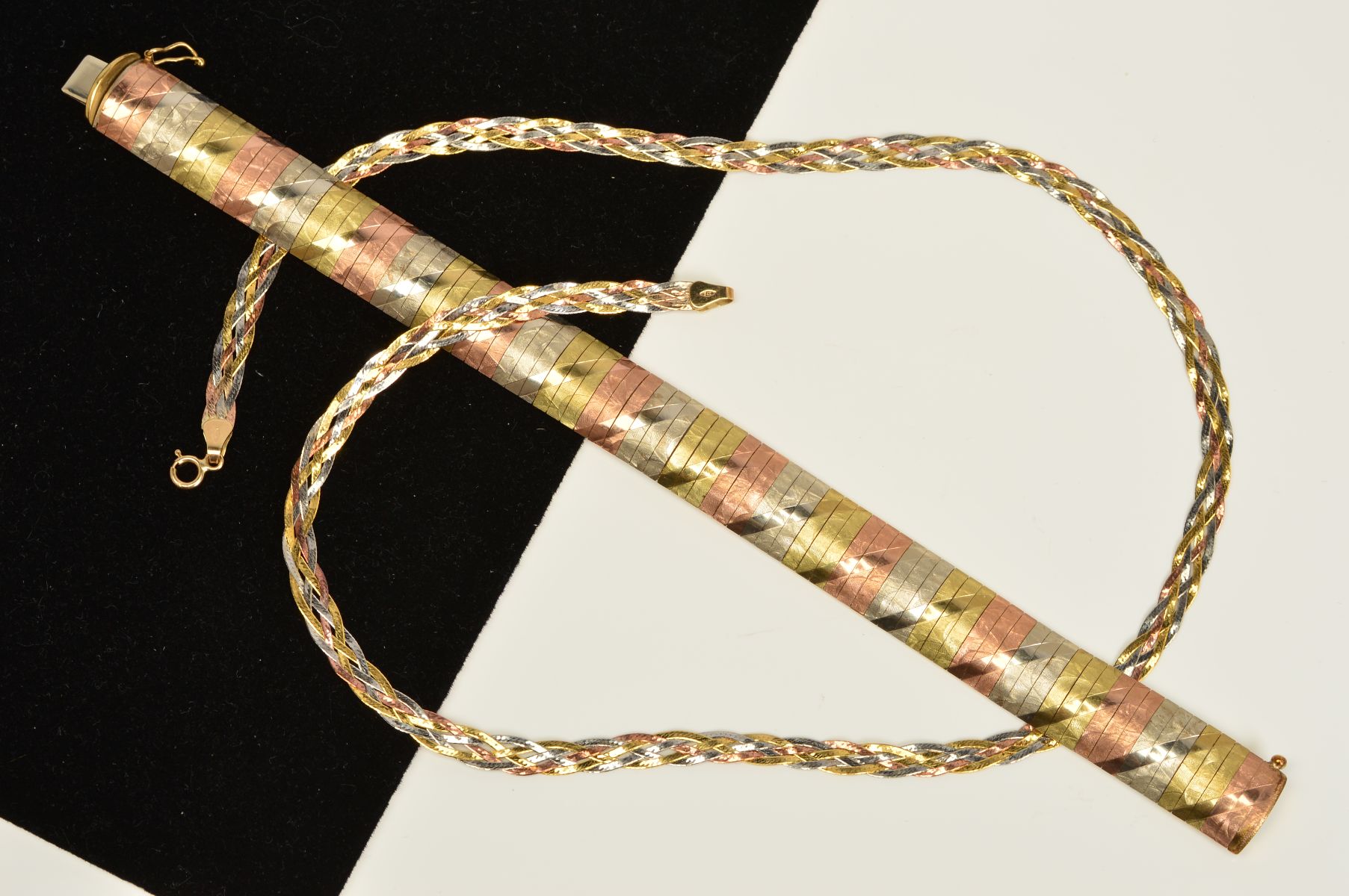 A TRI-COLOUR NECKLACE AND BRACELET SET, the necklace designed with a tri-colour plaited