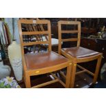 A SET OF FIVE BEECH CHAIRS with light brown drop in seat pads (two on show, three in store) (The